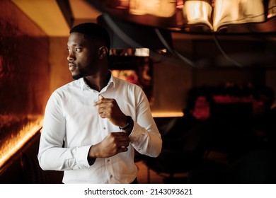 Portrait of handsome African American groom. Attractive charming man look at the camera, smiling, excited about marriage. Young adult business male in stylish formal wear. High quality photo - Powered by Shutterstock