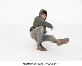 Portrait Of Handsome Asian Hip Hop Dancer Dancing In The Studio, Isolated On White Background.