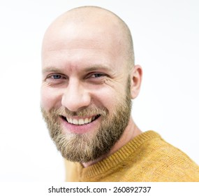 Portrait Of A Handsome Bald Young Man With Beard Smiling