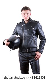 Portrait Of Handsome Biker Man Wearing Black Leather Jacket And Pants Holding Motorcycle Helmet