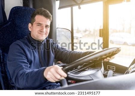 Portrait of handsome bus driver of public transport, concept of urban public transport