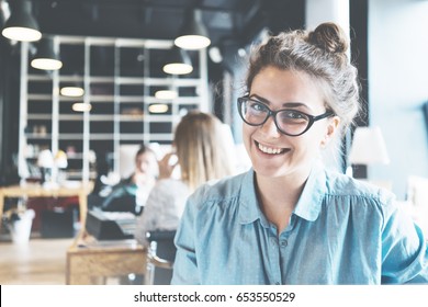 Portrait Of Handsome Business Lady Working At Big Coworking. Ordinary Workday In Loft Office