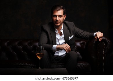 8,555 Man suit on couch Images, Stock Photos & Vectors | Shutterstock