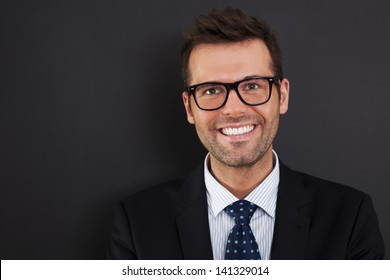 Portrait of handsome businessman wearing glasses  