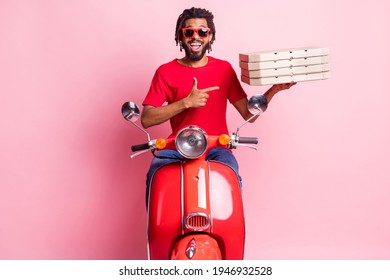 Portrait of handsome cheery amazed guy riding moped delivering demonstrating pizza advert isolated over pink pastel color background - Powered by Shutterstock