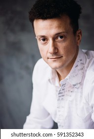 Portrait Of Handsome Curly Man With Thin Lips