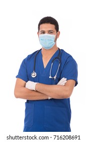 Portrait Of A Handsome Doctor In Scrubs With Stethoscope Standing Confidently And Wearing Mask, Isolated On White Background