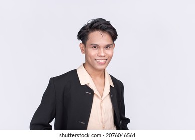 Portrait Of A Handsome Filipino Office Employee In His Early 20s. Isolated In White Backdrop.