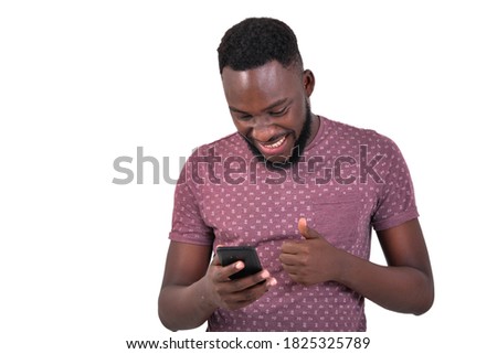 Similar – African man blue background with mobile phone.