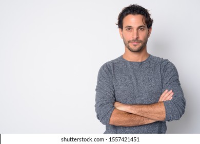 Portrait of handsome Hispanic man with arms crossed