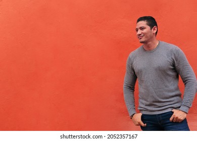 Portrait Of A Handsome Latino Hipster Walking Down The Street. Lifestyle Concept