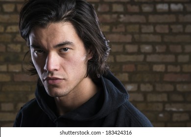 Portrait of handsome Malaysian man  wearing hoodie