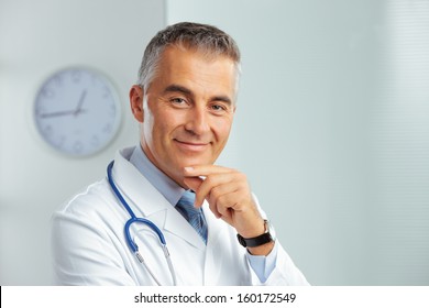 Portrait Of A Handsome Male Doctor Smiling At Camera