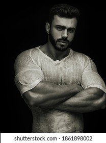 Portrait Of Handsome Male Fitness Model Crossing His Arms