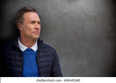 Portrait of handsome man against close-up of blackboard