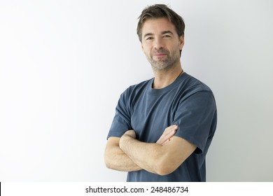 Portrait Of An Handsome Man Arms Crossed.This Photography Was Made With A Professional Model And  Others Professionals To Reach This Quality From A Raw.