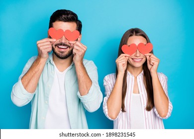 Portrait Of Handsome Man Attractive Lady Hold Heart Symbol Card Covering Eyes Isolated On Blue Color Background