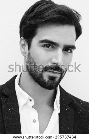 Similar – Guy with beard and modern hairstyle in urban background.