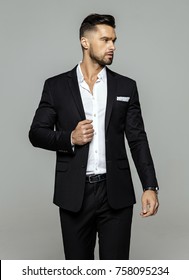 Portrait Of Handsome Man In Black Suit