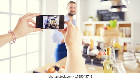 Portrait Of Handsome Man Filming Cooking Show Or Blog