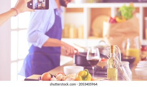 Portrait Of Handsome Man Filming Cooking Show Or Blog