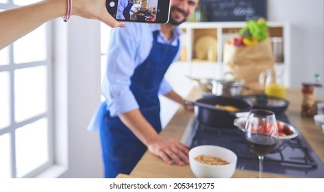 Portrait Of Handsome Man Filming Cooking Show Or Blog