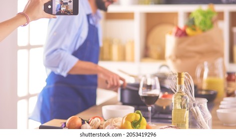 Portrait Of Handsome Man Filming Cooking Show Or Blog