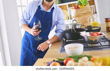 Portrait Of Handsome Man Filming Cooking Show Or Blog