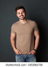 Portrait Of Handsome Man On Dark Background