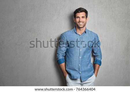 Image, Stock Photo Hispanic guy leaning on hand sitting against colorful illumination with opened mouth