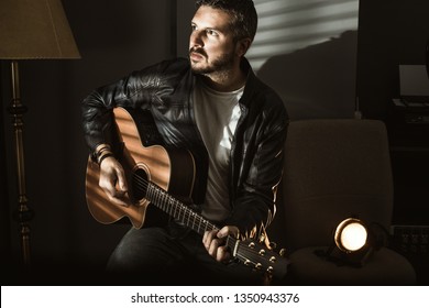 Portrait Of A Handsome Man With A Spanish Guitar. Guitarist Concept