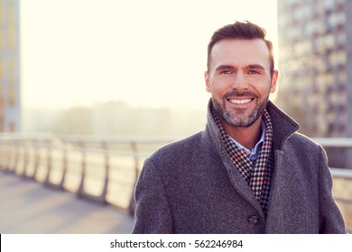 Portrait Of Handsome Man Wearing Coat During Cold Winter Evening