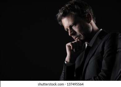 Portrait of a handsome mature man lost in deep thought