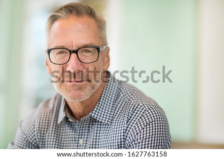 Portrait of a handsome mature man not smiling.