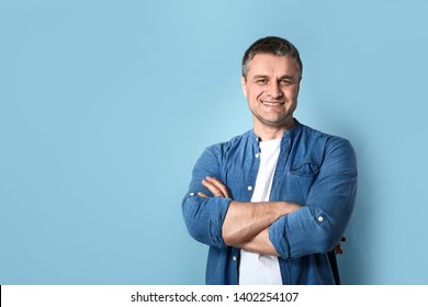 Portrait Of Handsome Mature Man On Color Background