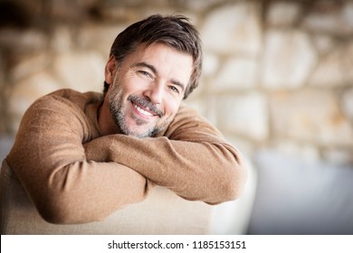 Portrait Of A Handsome Mature Man Smiling.