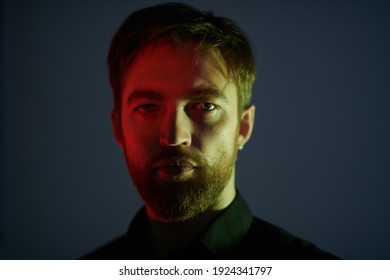 Portrait Of A Handsome Middle Aged Man In Black Shirt In A Mixed Light In Dark. Men's Beauty. 