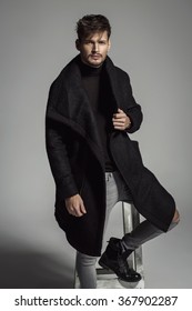 Portrait Of Handsome Model In Black Long Coat