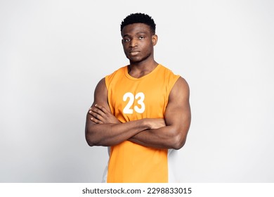 Portrait of handsome muscular African man, serious basketball player with arms crossed looking at camera, isolated on white background. Sport concept   - Powered by Shutterstock