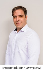 Portrait Of Handsome Persian Man Against Plain Background Vertical Shot