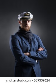 Portrait of a handsome sailor over black background.  Shipping, navigation, marine, navy concept. 