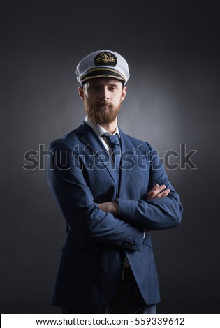 Portrait of a handsome sailor over black background.  Shipping, navigation, marine, navy concept. 