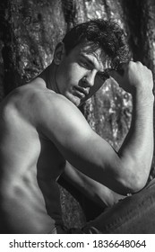 Portrait Of Handsome Sexy Male Model Posing Shirtless And Staring At The Camera. Black And White