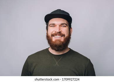 portrait of handsome smiling bearded man and looking confident at the camera - Shutterstock ID 1709927224