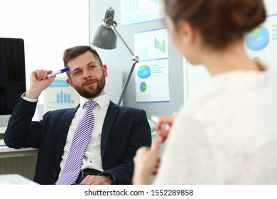 Portrait Of Handsome Smiling Man. Board Member Speaking And Ask Questions To Manager About Financial Statements. Company And Business Meeting Concept. Blurred Background