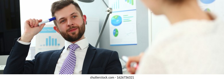 Portrait Of Handsome Smiling Man. Board Member Speaking And Ask Questions To Manager About Financial Statements. Company And Business Meeting Concept. Blurred Background