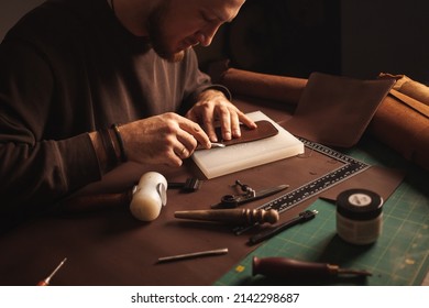 Portrait of handsome tanner man at work, small business, authentic workshop, indoors. leather goods. brown - Powered by Shutterstock