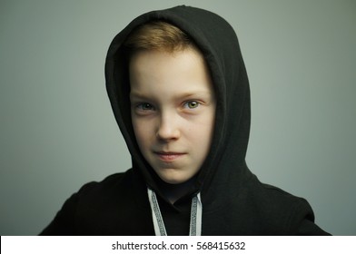 Portrait Of A Handsome Teenage Bad Boy With Slingshot And Stylish Haircut, Softbox Lighting Studio Shot.