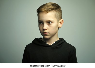 Portrait Of A Handsome Teenage Bad Boy With Stylish Haircut, Softbox Lighting Studio Shot.