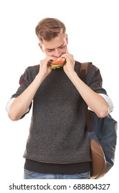 Portrait Of Handsome Teenage Student Eating Sandwich